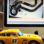 NeuroRacer: Beating humans in slot-car racing